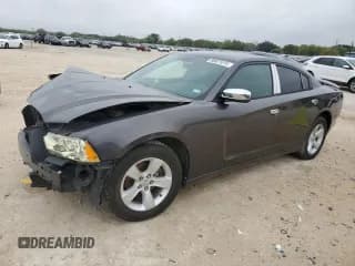 ✅ 2013 Dodge Charger SE • VIN: 2C3CDXBG8DH668509 • Lot: 90021015. Listed on Copart with 133,380 mi. Free auction sales archive from the USA and detailed vehicle history report at DreamBid. Image 1.