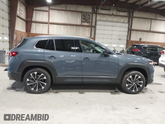 ✅ 2025 Mazda CX-50 Hybrid Premium Plus Package • VIN: 7MMVAAEW1SN102161 • Lot: 41846324. Wystawiony na IAAI z przebiegiem 2 793 mil. Bezpłatny archiwum sprzedaży aukcyjnych z USA i szczegółowy raport historii pojazdu na DreamBid. Zdjęcie 14.