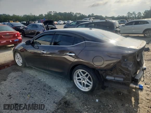 ✅ 2016 Nissan Maxima Platinum • VIN: 1N4AA6AP1GC448469 • Лот: 61252455. Опубликован ранее на Copart с пробегом 171 198 миль. Бесплатный доступ к архиву аукционных продаж из США и подробный отчёт об истории автомобиля на DreamBid. Изображение 2.