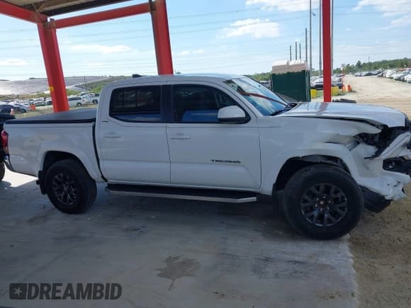 ✅ 2023 Toyota Tacoma SR5 • VIN: 3TYAZ5CN1PT031008 • Lot: 43735711. Listed on IAAI with 20,244 mi. Free auction sales archive from the USA and detailed vehicle history report at DreamBid. Image 13.