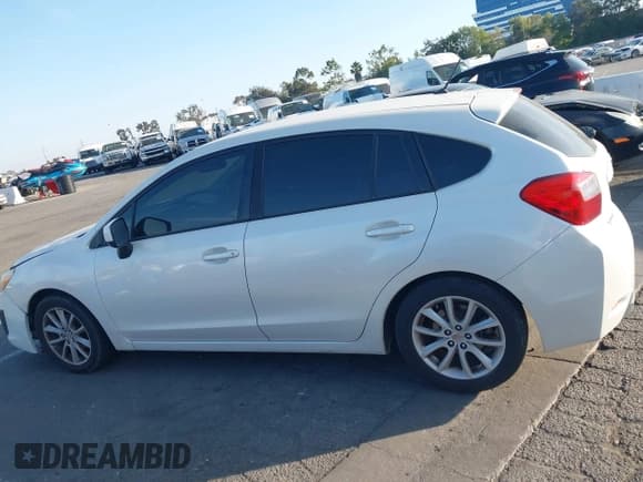 ✅ 2014 Subaru Impreza Premium • VIN: JF1GPAC63E8238214 • Lot: 43571560. Listed on IAAI with 128,610 mi. Free auction sales archive from the USA and detailed vehicle history report at DreamBid. Image 14.