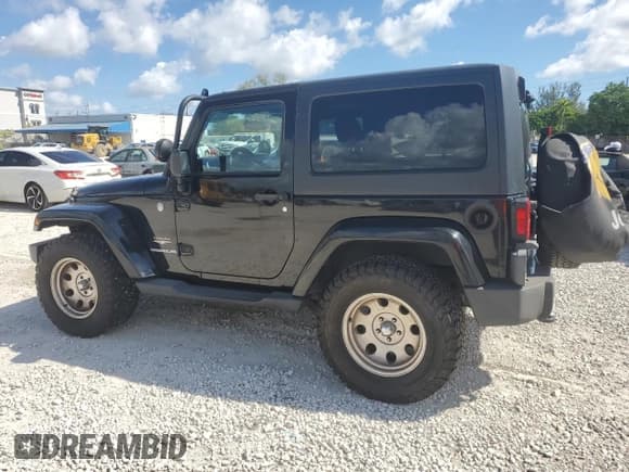 ✅ 2011 Jeep Wrangler Sahara • VIN: 1J4GA5D16BL550388 • Lot: 82650165. Listed on Copart with 197,063 mi. Free auction sales archive from the USA and detailed vehicle history report at DreamBid. Image 2.