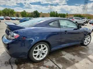 ✅ 2008 Hyundai Tiburon GT • VIN: KMHHN66F78U288604 • Лот: 70559655. Опубликован ранее на Copart с пробегом 92 082 миль. Бесплатный доступ к архиву аукционных продаж из США и подробный отчёт об истории автомобиля на DreamBid. Изображение 3.