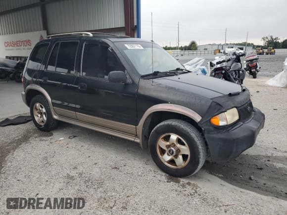 ✅ 2002 Kia Sportage • VIN: KNDJB723225136909 • Lot: 72007115. Listed on Copart with 107,720 mi. Free auction sales archive from the USA and detailed vehicle history report at DreamBid. Image 4.