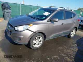 2012 Hyundai Tucson Limited with VIN KM8JUCAC5CU397149, listed as a IAAI auction lot 43491379 with 106,478 mi miles and . Bid and sale history available at DreamBid. Image 2.
