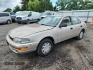 ✅ 1993 Toyota Camry DLX • VIN: 4T1SK11E6PU180747 • Lot: 64990075. Wystawiony na Copart z przebiegiem 109 692 mil. Bezpłatny archiwum sprzedaży aukcyjnych z USA i szczegółowy raport historii pojazdu na DreamBid. Zdjęcie 1.