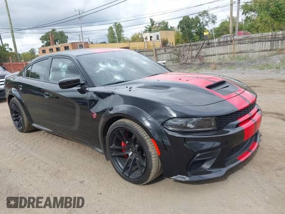 2022 Dodge Charger SRT Hellcat Widebody z VIN 2C3CDXL99NH199819, wystawiony jako IAAI lot #43450586 z przebiegiem 21 491 mil mil oraz . Historia ofert i sprzedaży dostępna na DreamBid. Obrazek 1.