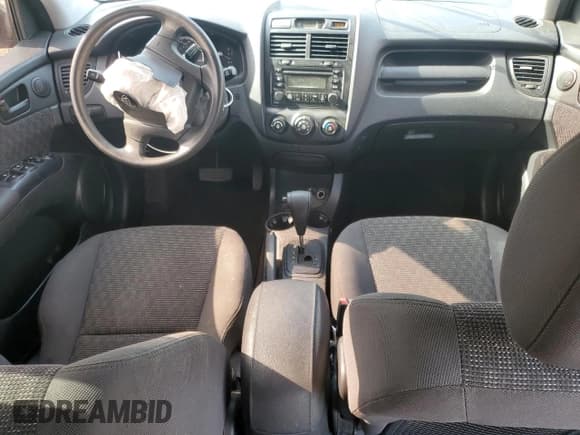 ✅ 2007 Kia Sportage LX • VIN: KNDJF724X77450865 • Lot: 66811595. Wystawiony na Copart z przebiegiem 119 710 mil. Bezpłatny archiwum sprzedaży aukcyjnych z USA i szczegółowy raport historii pojazdu na DreamBid. Zdjęcie 8.