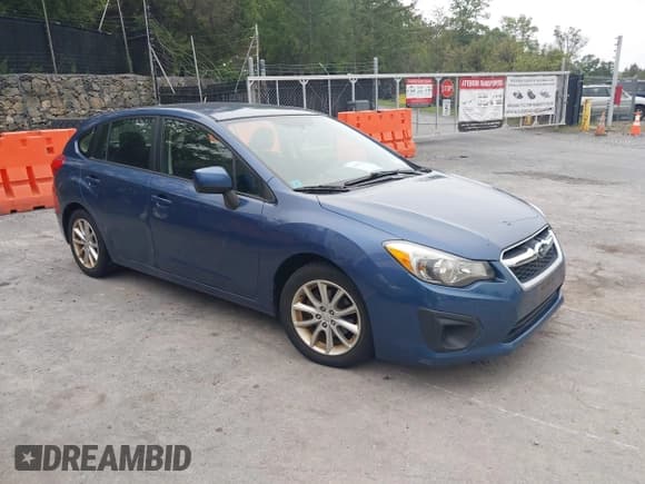 ✅ 2012 Subaru Impreza Premium • VIN: JF1GPAC66CH220187 • Lot: 43027202. Listed on IAAI with 139,721 mi. Free auction sales archive from the USA and detailed vehicle history report at DreamBid. Image 1.