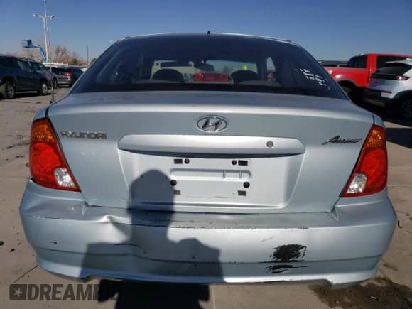 2005 Hyundai Accent GLS z VIN KMHCG35C55U337255, wystawiony jako Copart lot #43761985 z przebiegiem 192 585 mil mil oraz Szkoda całkowita • Salvage title. Historia ofert i sprzedaży dostępna na DreamBid. Obrazek 6.