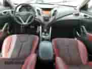 2012 Hyundai Veloster w/Red Int z VIN KMHTC6AD4CU055889, wystawiony jako Copart lot #62264394 z przebiegiem 138 504 mil mil oraz Szkoda całkowita • Salvage title. Historia ofert i sprzedaży dostępna na DreamBid. Obrazek 8.