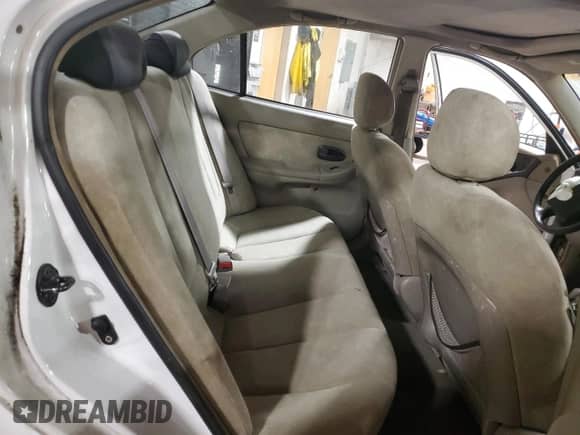 2003 Hyundai Elantra GLS z VIN KMHDN45D23U489919, wystawiony jako Copart lot #83390934 z przebiegiem Nie podano mil oraz Szkoda całkowita • Salvage title. Historia ofert i sprzedaży dostępna na DreamBid. Obrazek 10.