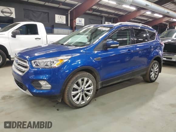 2017 Ford Escape Titanium с VIN 1FMCU9J95HUC08605, выставлен на аукционе Copart как лот 90461165 с пробегом 136 216 миль миль и Чистый • Clean title. История ставок и продаж доступна на DreamBid. Изображение 1.