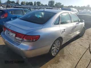 2010 Hyundai Azera Limited z VIN KMHFC4DF8AA451045, wystawiony jako Copart lot #71666433 z przebiegiem 143 429 mil mil oraz Szkoda całkowita • Salvage title. Historia ofert i sprzedaży dostępna na DreamBid. Obrazek 3.