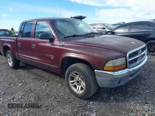 2002 Dodge Dakota SLT z VIN 1B7HL48N32S716822, wystawiony jako IAAI lot #41587416 z przebiegiem 216 201 mil mil oraz . Historia ofert i sprzedaży dostępna na DreamBid. Obrazek 1.
