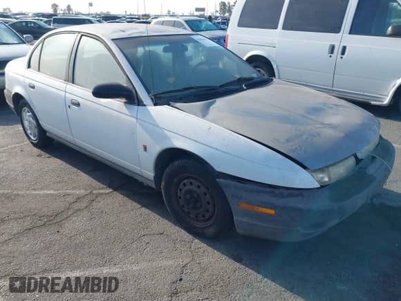 1998 Saturn SL z VIN 1G8ZF5284WZ303478, wystawiony jako IAAI lot #42946026 z przebiegiem 175 786 mil mil oraz . Historia ofert i sprzedaży dostępna na DreamBid. Obrazek 1.