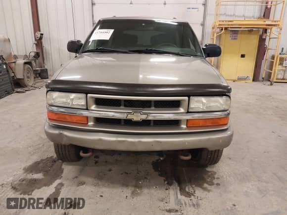 2004 Chevrolet Blazer LS with VIN 1GNCT18X64K126098, listed as a IAAI auction lot 41744502 with 26 mi miles and . Bid and sale history available at DreamBid. Image 6.