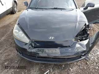 ✅ 2008 Hyundai Tiburon GT • VIN: KMHHN66FX8U268394 • Лот: 43293640. Опубликован ранее на IAAI с пробегом 66 751 миль. Бесплатный доступ к архиву аукционных продаж из США и подробный отчёт об истории автомобиля на DreamBid. Изображение 6.