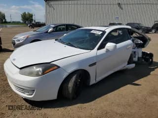 ✅ 2008 Hyundai Tiburon GS • VIN: KMHHM65D88U276240 • Лот: 68894235. Опубликован ранее на Copart с пробегом 220 049 миль. Бесплатный доступ к архиву аукционных продаж из США и подробный отчёт об истории автомобиля на DreamBid. Изображение 1.