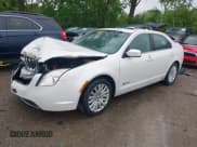 ✅ 2010 Mercury Milan Hybrid • VIN: 3MEDM0L35AR612321 • Lot: 42297872. Listed on IAAI with 205,182 mi. Free auction sales archive from the USA and detailed vehicle history report at DreamBid. Image 2.