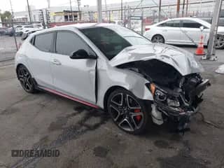 2020 Hyundai Veloster z VIN KMHT36AH6LU008009, wystawiony jako IAAI lot #41775605 z przebiegiem 84 029 mil mil oraz . Historia ofert i sprzedaży dostępna na DreamBid. Obrazek 1.