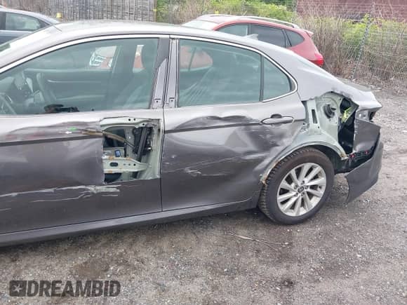 2021 Toyota Camry LE with VIN 4T1C11BK5MU028031, listed as a IAAI auction lot 42502600 with 115,138 mi miles and . Bid and sale history available at DreamBid. Image 6.