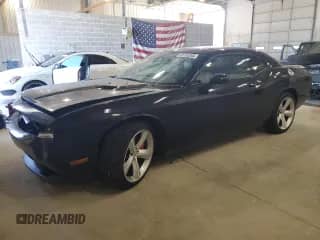 2009 Dodge Challenger SRT-8 z VIN 2B3LJ74W29H590598, wystawiony jako Copart lot #69135265 z przebiegiem 30 542 mil mil oraz Szkoda całkowita • Salvage title. Historia ofert i sprzedaży dostępna na DreamBid. Obrazek 1.