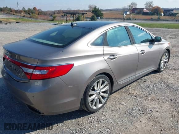 2013 Hyundai Azera with VIN KMHFH4JGXDA303112, listed as a IAAI auction lot 43611021 with 107,219 mi miles and . Bid and sale history available at DreamBid. Image 4.