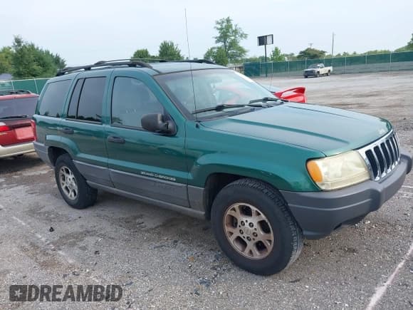 ✅ 1999 Jeep Grand Cherokee Laredo • VIN: 1J4G258S5XC543617 • Lot: 39937200. Listed on IAAI with 133,461 mi. Free auction sales archive from the USA and detailed vehicle history report at DreamBid. Image 1.