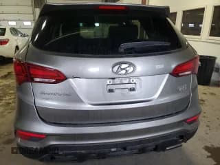 ✅ 2018 Hyundai Santa Fe 2.4L • VIN: 5NMZTDLB0JH082963 • Лот: 70990512. Опубликован ранее на Copart с пробегом 96 185 миль. Бесплатный доступ к архиву аукционных продаж из США и подробный отчёт об истории автомобиля на DreamBid. Изображение 6.