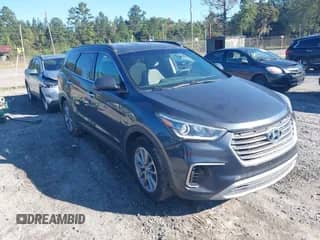 2017 Hyundai Santa Fe SE z VIN KM8SMDHFXHU166104, wystawiony jako IAAI lot #43470215 z przebiegiem 148 527 mil mil oraz . Historia ofert i sprzedaży dostępna na DreamBid. Obrazek 1.