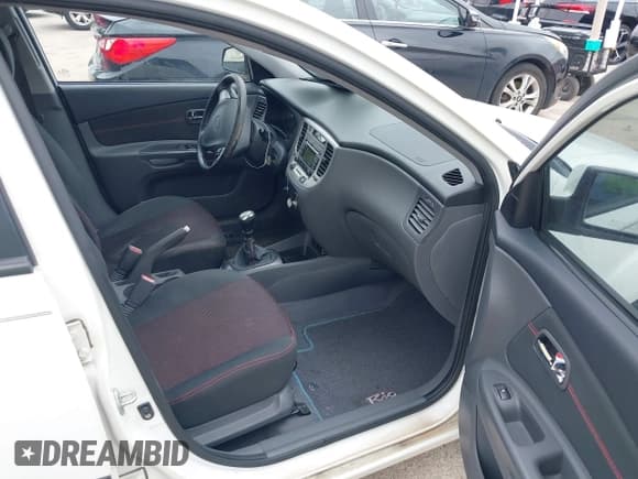 ✅ 2009 Kia Rio LX • VIN: KNADE223096557455 • Lot: 42432576. Listed on IAAI with 155,523 mi. Free auction sales archive from the USA and detailed vehicle history report at DreamBid. Image 5.