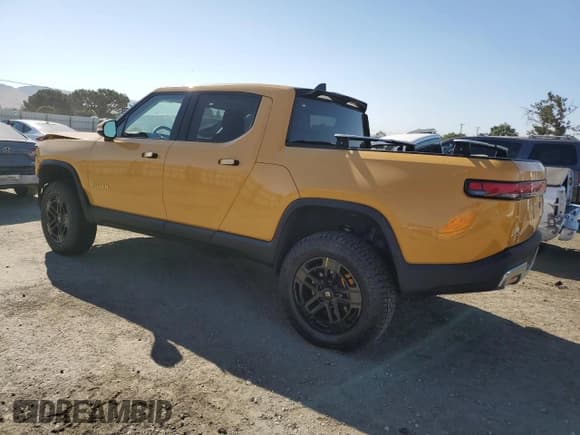 ✅ 2023 Rivian R1T Adventure • VIN: 7FCTGAAA8PN022857 • Lot: 63064315. Listed on Copart with 40,379 mi. Free auction sales archive from the USA and detailed vehicle history report at DreamBid. Image 2.