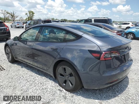 ✅ 2023 Tesla Model 3 • VIN: 5YJ3E1EA1PF407231 • Лот: 60969045. Опубликован ранее на Copart с пробегом 34 811 миль. Бесплатный доступ к архиву аукционных продаж из США и подробный отчёт об истории автомобиля на DreamBid. Изображение 2.