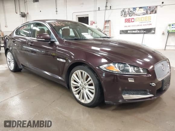 ✅ 2012 Jaguar XF Portfolio • VIN: SAJWA0HB1CLS34259 • Lot: 42873865. Listed on IAAI with 143,002 mi. Free auction sales archive from the USA and detailed vehicle history report at DreamBid. Image 1.