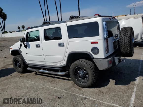 ✅ 2005 Hummer H2 SUV • VIN: 5GRGN23U35H132428 • Lot: 74594554. Listed on Copart with 107,701 mi. Free auction sales archive from the USA and detailed vehicle history report at DreamBid. Image 2.