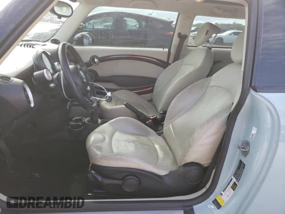 2012 MINI Hardtop with VIN WMWSU3C52CT367682, listed as a Copart auction lot 63045965 with 124,683 mi miles and Salvage title. Bid and sale history available at DreamBid. Image 7.