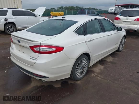 ✅ 2014 Ford Fusion Titanium Hybrid • VIN: 3FA6P0RU7ER157789 • Lot: 43177404. Listed on IAAI with 198,237 mi. Free auction sales archive from the USA and detailed vehicle history report at DreamBid. Image 4.