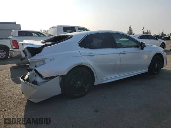 2021 Toyota Camry Hybrid XSE с VIN 4T1K31AKXMU548944, выставлен на аукционе Copart как лот 68894265 с пробегом 81 648 миль миль и Списание • Salvage title. История ставок и продаж доступна на DreamBid. Изображение 3.