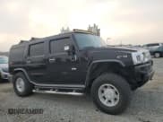 ✅ 2003 Hummer H2 • VIN: 5GRGN23U03H137888 • Lot: 90076345. Listed on Copart with 232,599 mi. Free auction sales archive from the USA and detailed vehicle history report at DreamBid. Image 4.