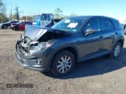 ✅ 2016 Mazda CX-5 Touring • VIN: JM3KE4CY2G0773542 • Lot: 43512519. Listed on IAAI with 64,878 mi. Free auction sales archive from the USA and detailed vehicle history report at DreamBid. Image 17.