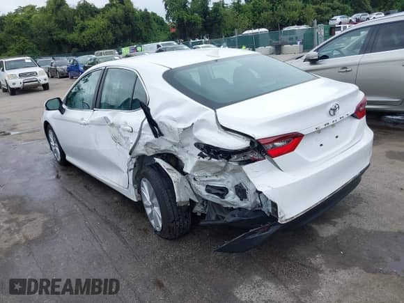 2022 Toyota Camry LE with VIN 4T1R11BK3NU064246, listed as a IAAI auction lot 43037907 with 64,971 mi miles and . Bid and sale history available at DreamBid. Image 3.