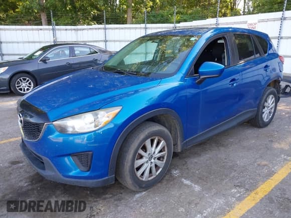 ✅ 2014 Mazda CX-5 Sport • VIN: JM3KE2BE7E0332563 • Lot: 42770891. Listed on IAAI with 145,924 mi. Free auction sales archive from the USA and detailed vehicle history report at DreamBid. Image 2.