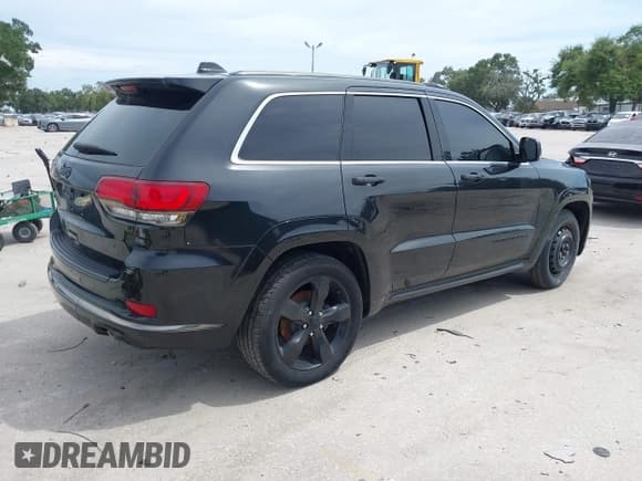 ✅ 2015 Jeep Grand Cherokee Overland • VIN: 1C4RJECG0FC242630 • Lot: 42813096. Listed on IAAI with 140,463 mi. Free auction sales archive from the USA and detailed vehicle history report at DreamBid. Image 4.