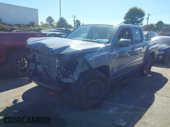 ✅ 2024 Nissan Frontier Pro-4X • VIN: 1N6ED1EK0RN631192 • Lot: 43470228. Listed on IAAI with 21,922 mi. Free auction sales archive from the USA and detailed vehicle history report at DreamBid. Image 2.