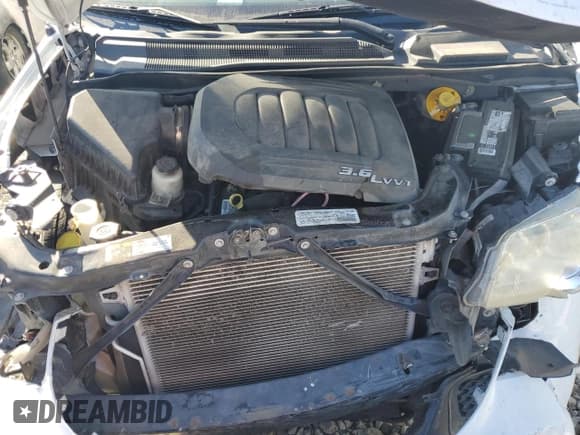 ✅ 2014 Dodge Grand Caravan SE • VIN: 2C4RDGBG8ER354490 • Lot: 91510875. Listed on Copart with 174,832 mi. Free auction sales archive from the USA and detailed vehicle history report at DreamBid. Image 12.