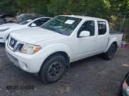 ✅ 2015 Nissan Frontier S • VIN: 1N6AD0EV0FN717018 • Lot: 42322428. Listed on IAAI with 104,715 mi. Free auction sales archive from the USA and detailed vehicle history report at DreamBid. Image 18.