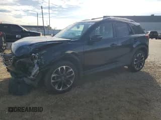 ✅ 2016 Mazda CX-5 Grand Touring • VIN: JM3KE4DY0G0830951 • Lot: 90806115. Listed on Copart with 138,884 mi. Free auction sales archive from the USA and detailed vehicle history report at DreamBid. Image 1.