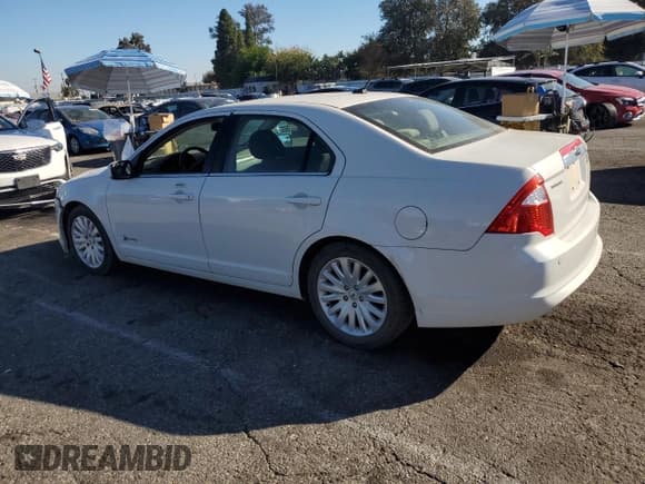 ✅ 2012 Ford Fusion Hybrid • VIN: 3FADP0L39CR193536 • Lot: 86220655. Wystawiony na Copart z przebiegiem 170 911 mil. Bezpłatny archiwum sprzedaży aukcyjnych z USA i szczegółowy raport historii pojazdu na DreamBid. Zdjęcie 2.