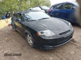 ✅ 2005 Hyundai Tiburon GS • VIN: KMHHM65D65U169098 • Лот: 43287856. Опубликован ранее на IAAI с пробегом 120 000 миль. Бесплатный доступ к архиву аукционных продаж из США и подробный отчёт об истории автомобиля на DreamBid. Изображение 1.